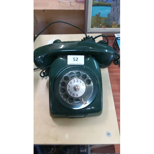 52 - Vintage dark rotary dial telephone, from the mid-20th century. Features an iconic design with circul... 