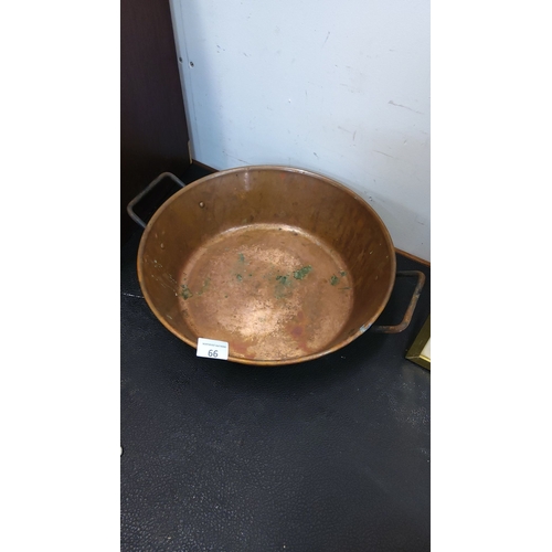 66 - Large round copper preserve pot with two side brass handles.