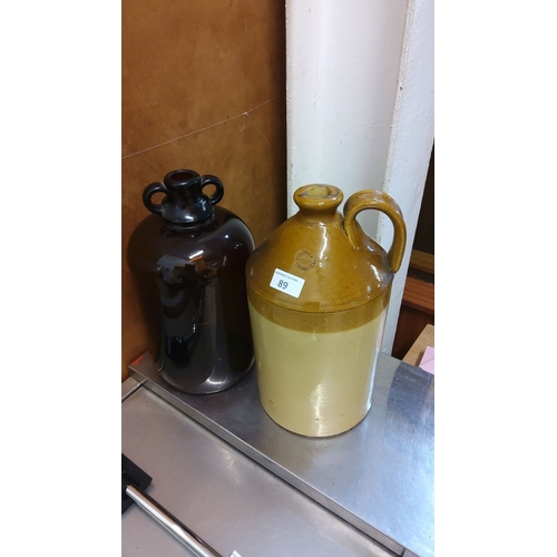 89 - Large stoneware jug & Demi John