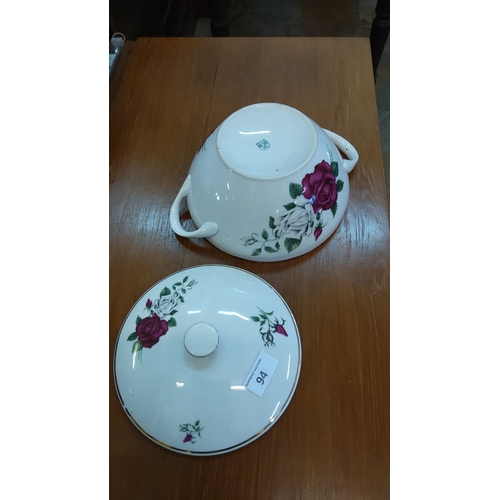 94 - Porcelain tureen with matching lid, featuring rose and white floral decorations, and gold trim accen... 