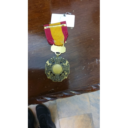 111 - Vietnam Campaign Medal with Device (1960-1975) features a gold-tone metal cross with a red and yello... 