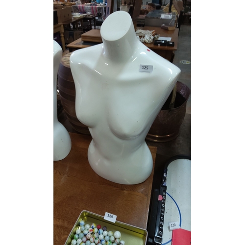 125 - Fiberglass female torso mannequin in glossy white finish. Free-standing design.