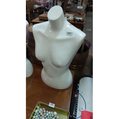 125 - Fiberglass female torso mannequin in glossy white finish. Free-standing design.