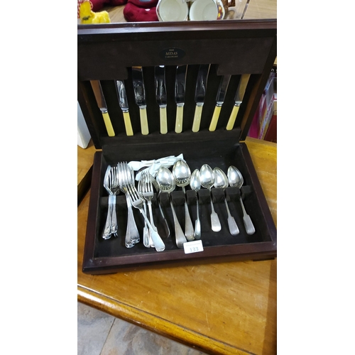 133 - Midas fine tableware set includes knives with bone-colored handles, and an assortment of stainless s... 