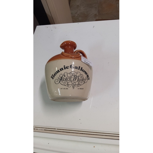 144 - Ceramic Bonnie Galloway Scotch Whisky jug, 7-year-old, 26 3/4 fl. oz., 70 proof, with a brown top an... 