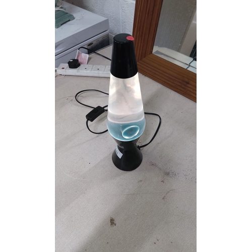 145 - Black lava lamp with clear liquid and white wax.(pwo)