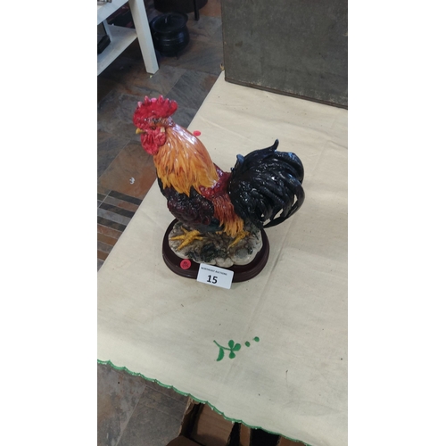 15 - Hand-painted ceramic rooster figurine on decorative base, showcasing vibrant colors.