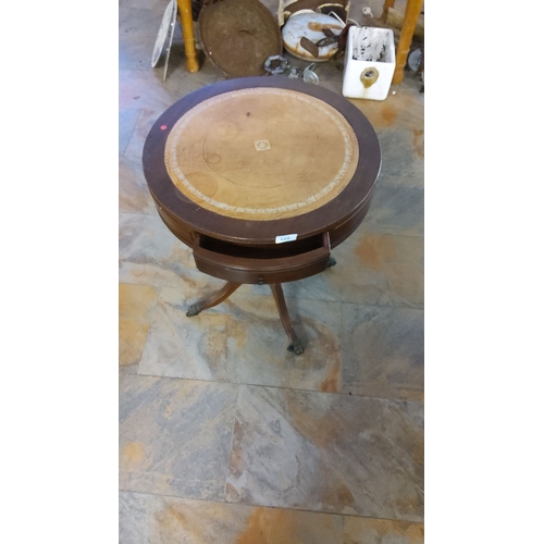 159 - Edwardian mahogany and inlaid drum table, featuring a single drawer and decorative banding. The pede... 