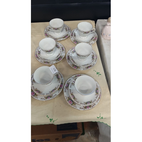 176 - Set of six china trios with floral patterns and gold trim.