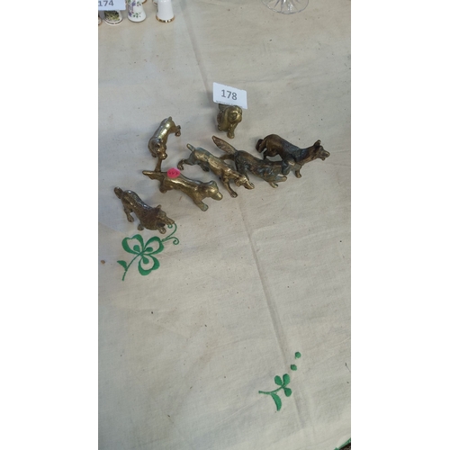 178 - Set of seven vintage brass animal figurines, including various breeds of dogs.