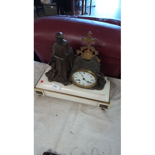 180 - 19th Century French mantel clock with bronze figure and ornate brass decorations, mounted on a white... 