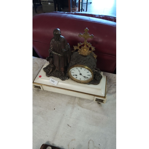 180 - 19th Century French mantel clock with bronze figure and ornate brass decorations, mounted on a white... 