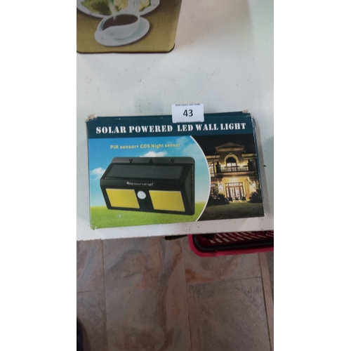 43 - Solar Powered LED Wall Light with PIR sensor and CDS Night sensor. In original packaging.