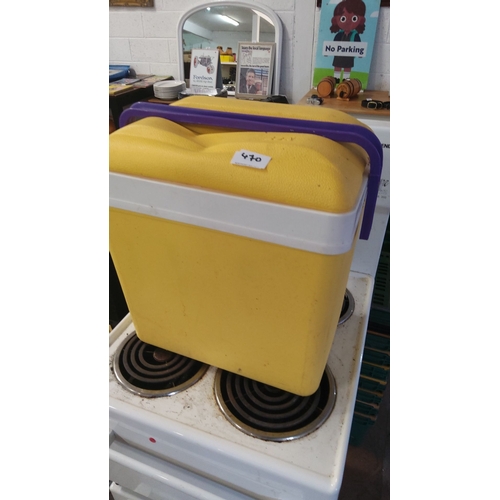 470 - Vintage yellow cooler box with a purple handle.