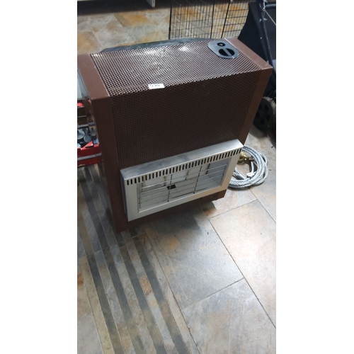 474 - Gas heater with brown metal casing and front chrome grill. Features a control dial on the top right ... 