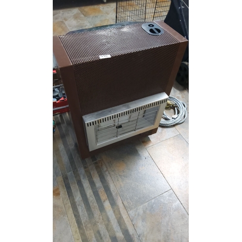 474 - Gas heater with brown metal casing and front chrome grill. Features a control dial on the top right ... 