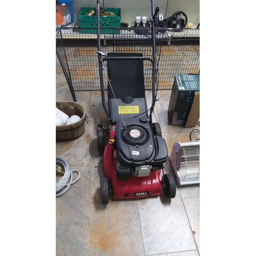 476 - Sanli OHV 4.0HP 4-stroke petrol lawnmower features a red and black design with a visible brand and m... 