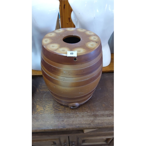 49 - Stoneware barrel-shaped crock, featuring brown gradient stripes and a spout.