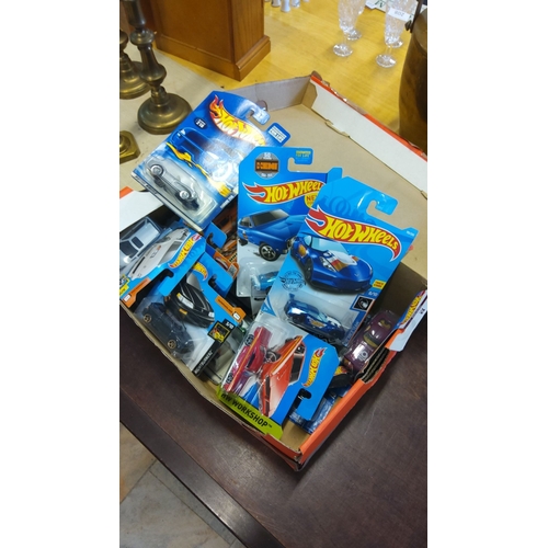 495 - Mixed lot of Hot Wheels die-cast cars, including various models in their original packaging.