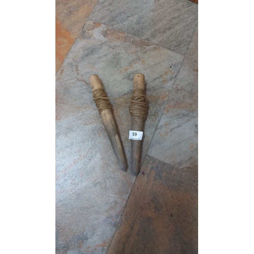 59 - Two wooden yarn spindles with wrapped twine. Rustic appearance.