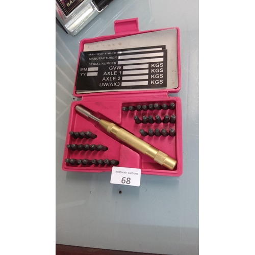 68 - Metal Stamping Kit with alphanumeric characters and a brass handle, housed in a pink plastic case.