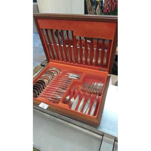 78 - 56-piece stainless steel cutlery set in a wooden presentation case, featuring a floral design on the... 