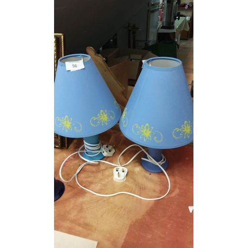 96 - Pair of blue table lamps with yellow floral design, fabric shades, and white electrical cords with U... 