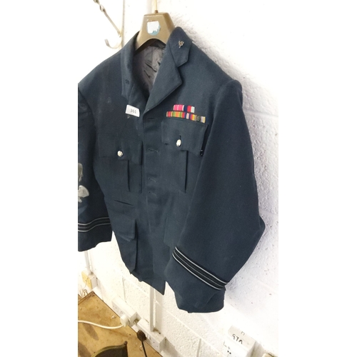 361 - Dark blue Royal Air Force uniform jacket with ribbon bar and insignia, featuring rank stripes on sle... 