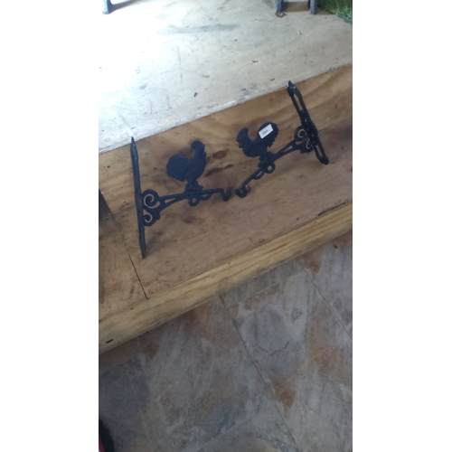 364 - Pair of cast iron rooster hanging basket  brackets with intricate scrollwork. Approximately 9 inches... 