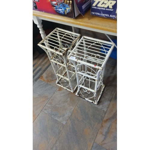 374 - Pair of vintage wrought iron adjustable grotto stands, painted white with decorative scrollwork. App... 