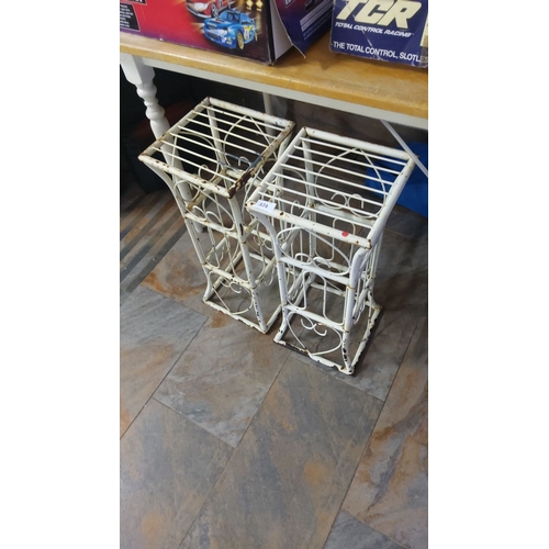 374 - Pair of vintage wrought iron adjustable grotto stands, painted white with decorative scrollwork. App... 