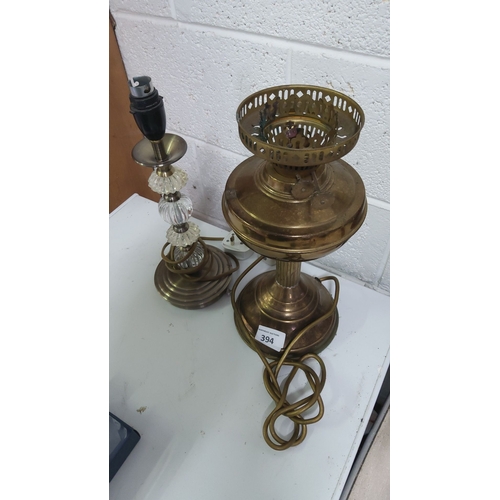 394 - Pair of vintage brass lamps with clear glass accents. Approximately 14 inches in height.