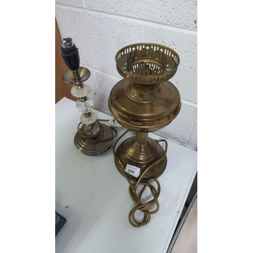 394 - Pair of vintage brass lamps with clear glass accents. Approximately 14 inches in height.