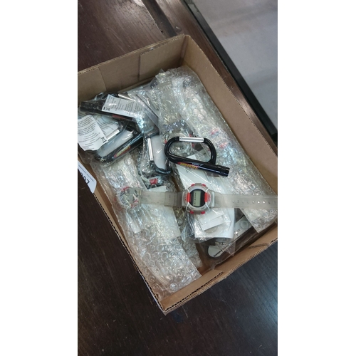 397 - Box of assorted gadgets, including digital watches and carabiner keychains, in original packaging. M... 
