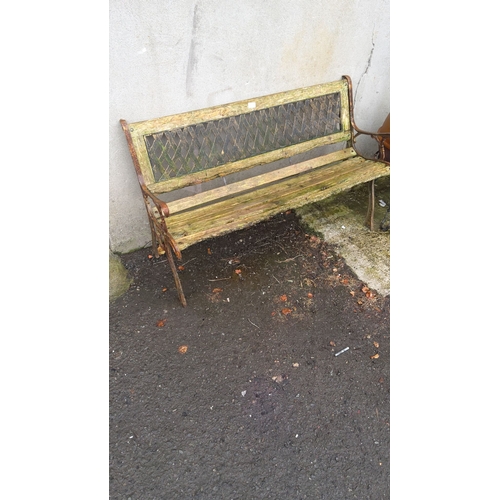 398 - Outdoor wooden and cast iron sides garden bench and a trellis backrest. Approximately 150cm wide, 50... 