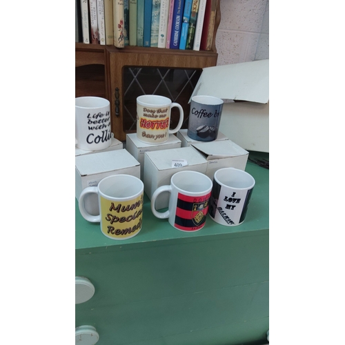 409 - Set of six novelty ceramic mugs with assorted humorous and themed designs. Each comes in individual ... 