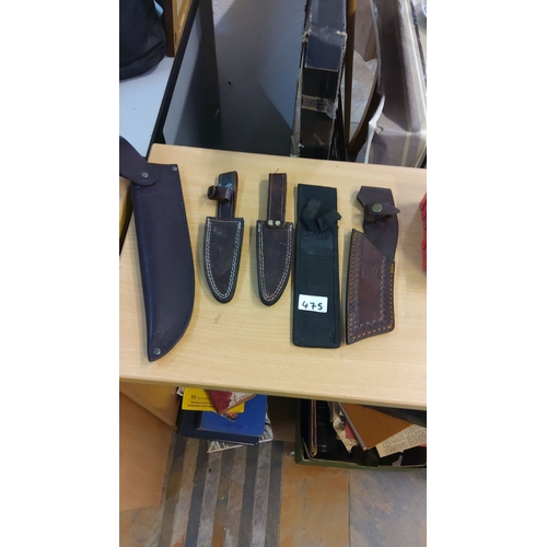 475 - Assorted knife sheaths, leather and nylon, five pieces total, featuring stitch detailing and button ... 