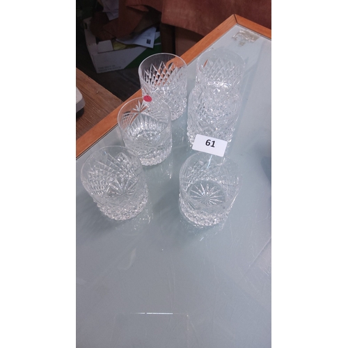 61 - Set of six cut crystal whiskey tumblers, featuring intricate starburst patterns