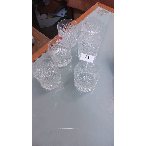 61 - Set of six cut crystal whiskey tumblers, featuring intricate starburst patterns