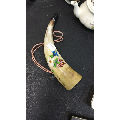 79 - Swiss Lucerne souvenir horn, painted with floral motifs. Includes a decorative cord.