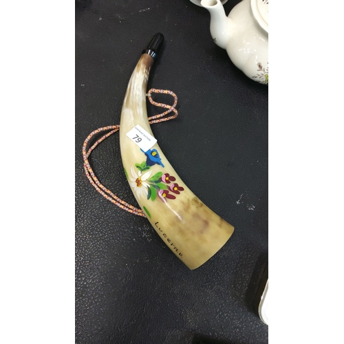 79 - Swiss Lucerne souvenir horn, painted with floral motifs. Includes a decorative cord.