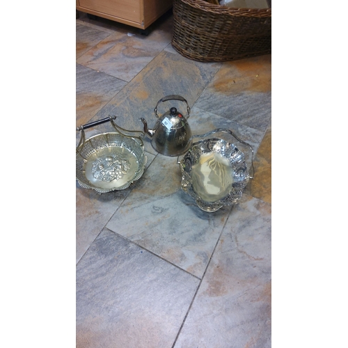 90 - Silver-plated set including a decorative tray, pierced basket with handle, and ornate teapot with di... 