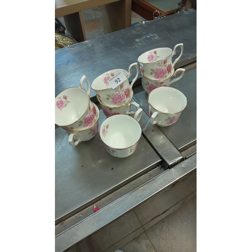 92 - Bone china Eire collection teacups, set of eight, featuring pink floral design with gold trim. Made ... 