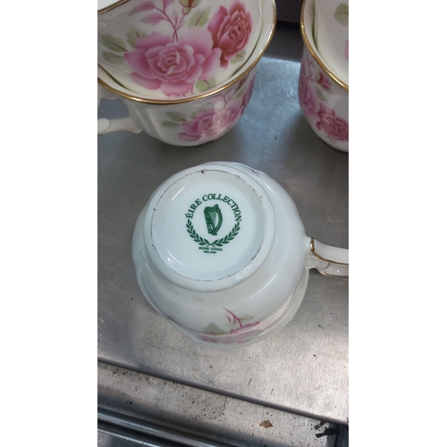 92 - Bone china Eire collection teacups, set of eight, featuring pink floral design with gold trim. Made ... 