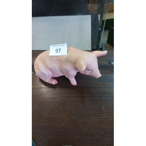 97 - Porcelain pig figurine, featuring a blue crown and letter 