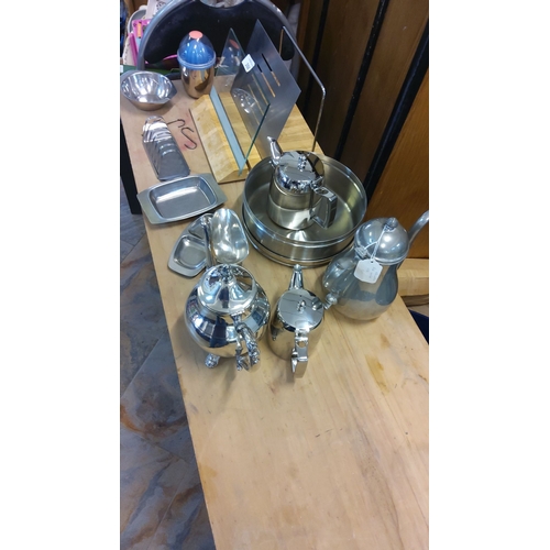 266 - Set of stainless steel & silver plated kitchen items including teapots, trays, and a container, feat... 