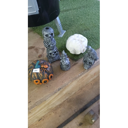 380 - Set of five Halloween-themed concrete decorative sculptures featuring skulls, pumpkins, and owls. Ap... 