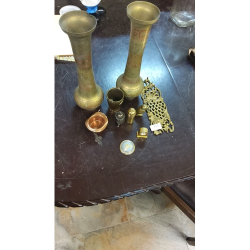 191 - Mixed decorative brass and metalware collection, featuring two ornate vases, intricate trivet, vario... 
