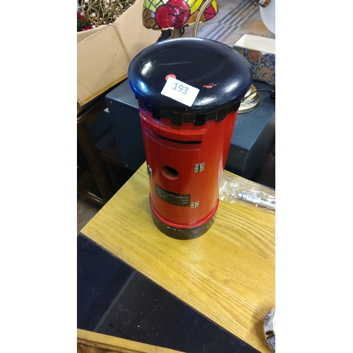 193 - Miniature wooden postbox model, painted red and black, features a hinged door with a small compartme... 