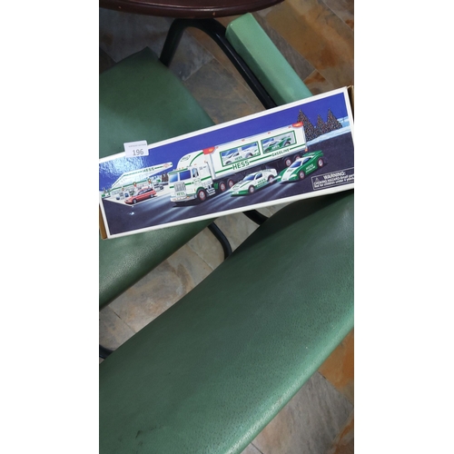 196 - Hess Toy Truck, complete with original box. Features vibrant artwork displaying classic delivery tru... 